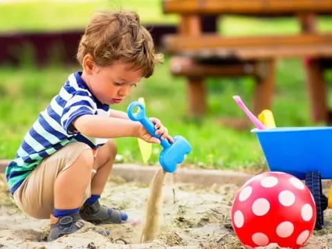a baby playing with a toy