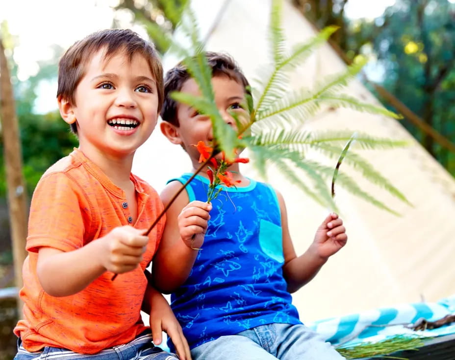 a couple of children playing outside