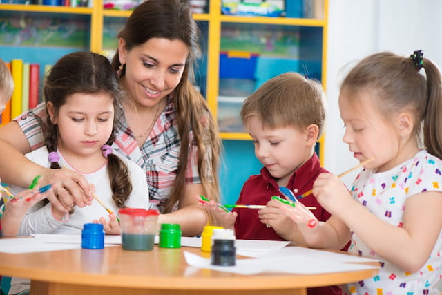 a person and children painting