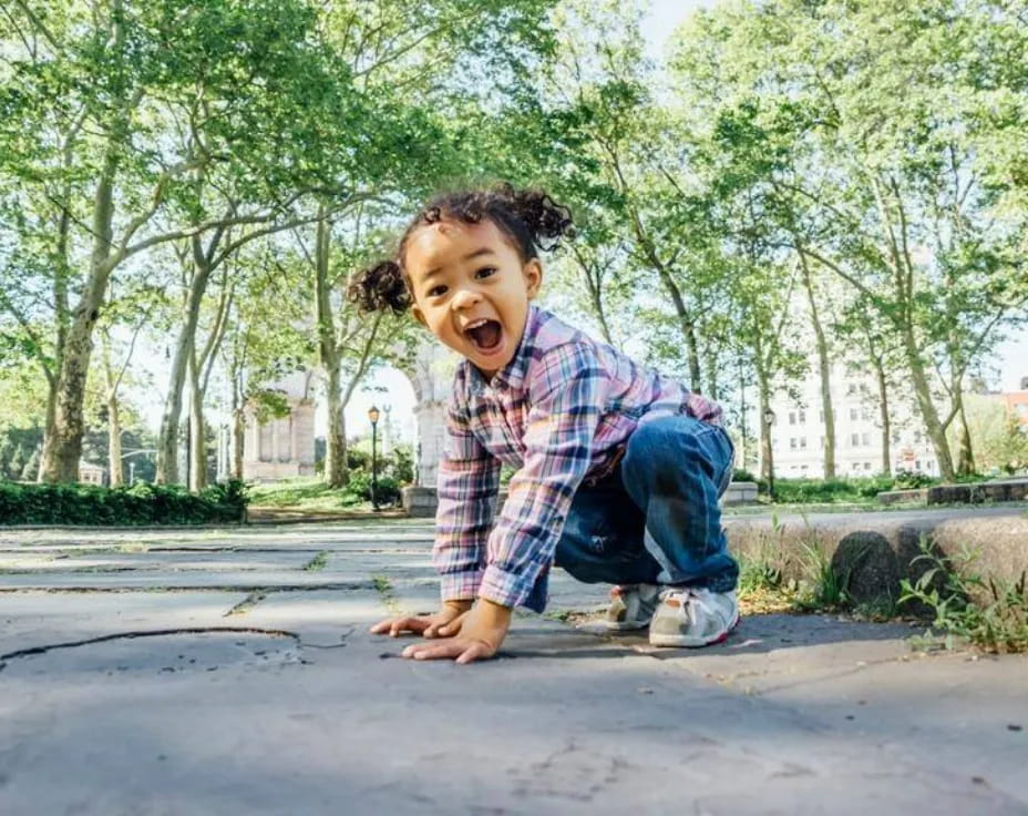 a girl sitting on the ground