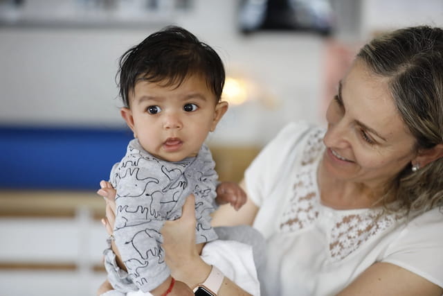a person holding a baby
