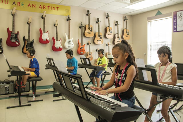 a group of people playing musical instruments