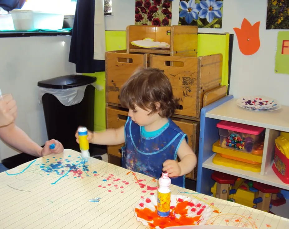 a child sitting at a table
