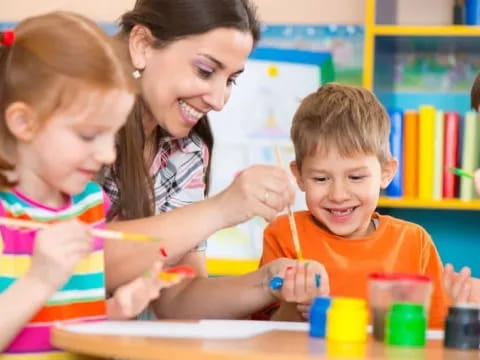 a person and children painting
