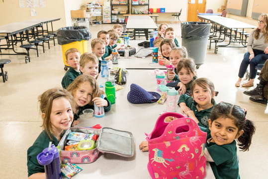 a group of children sitting in a circle