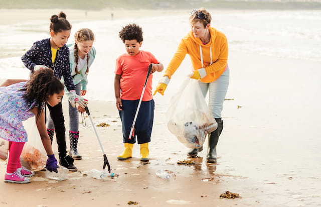 a group of children playing in the sand