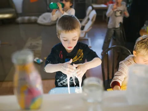 a boy sitting at a table