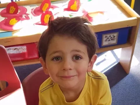a boy sitting in a chair