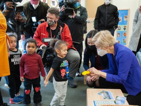 a person and a group of children