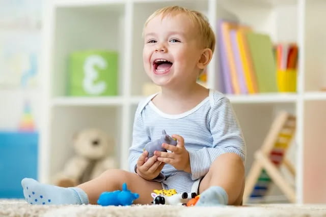 a baby playing with toys