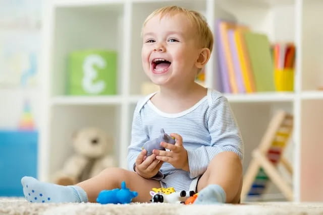 a baby playing with toys