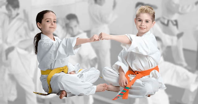 a couple of children in karate uniforms