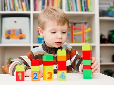 a child sitting at a table