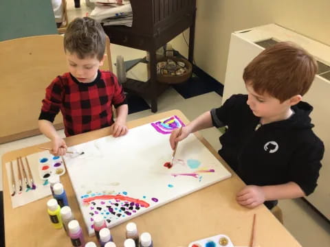a couple of boys playing with toys