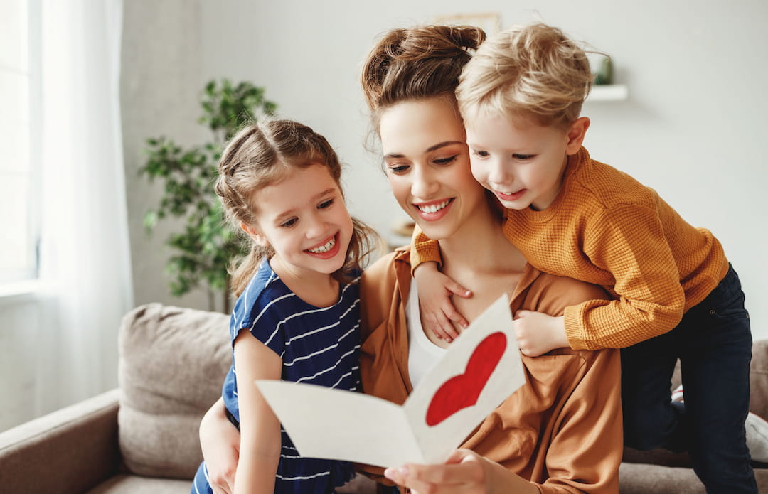 a group of children holding a book