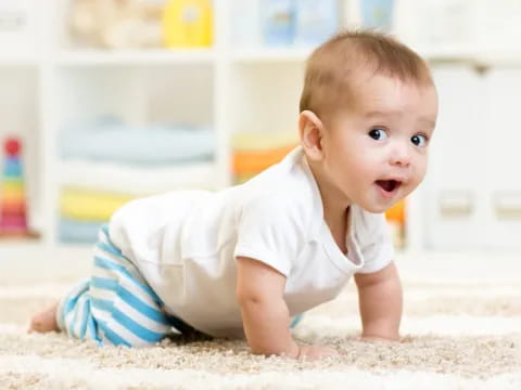 a baby crawling on the floor