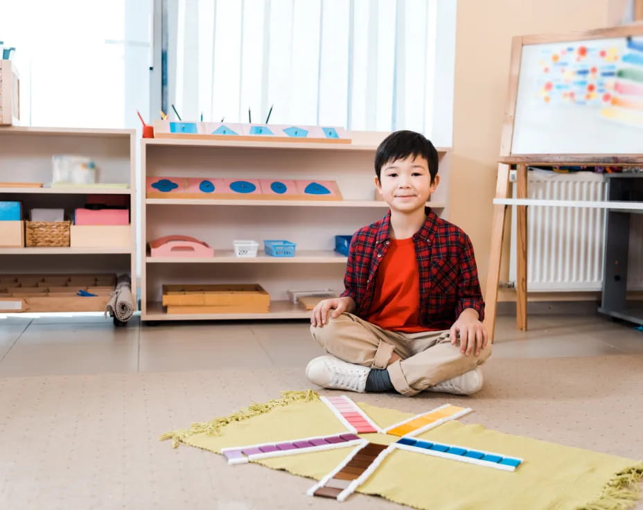 a boy sitting on the floor