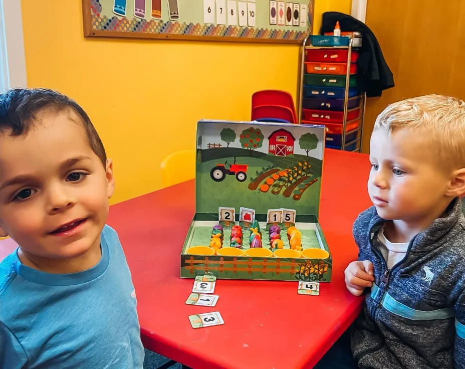 two children sitting at a table
