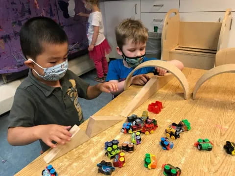 a couple of boys playing with toys