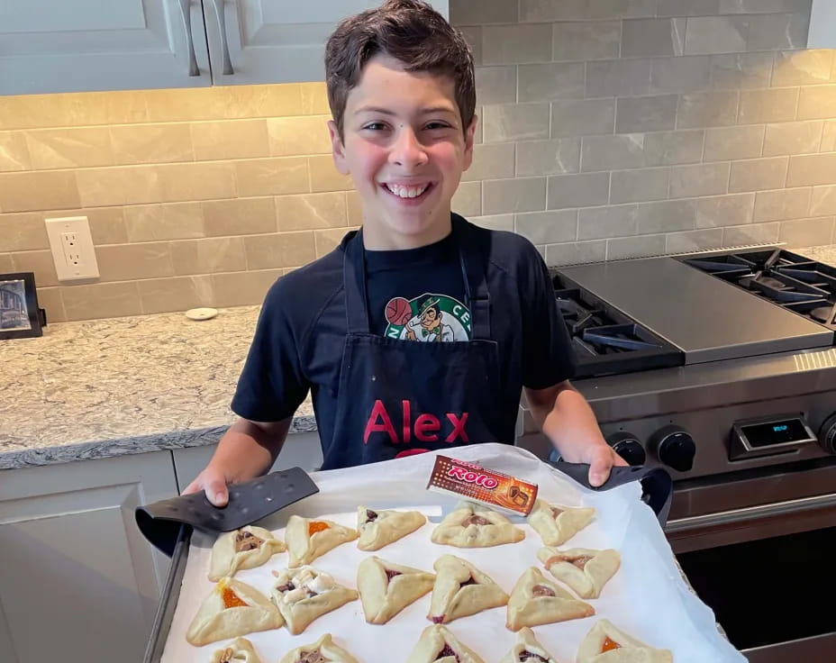 a boy holding a tray of food
