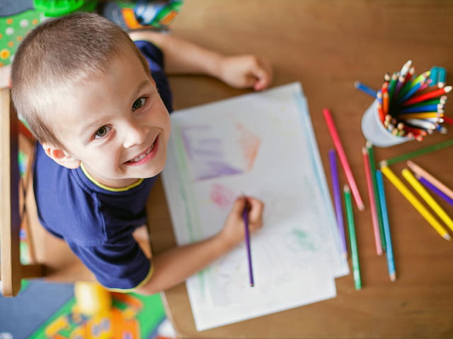a child sitting at a table