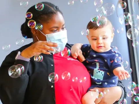 a person holding a baby