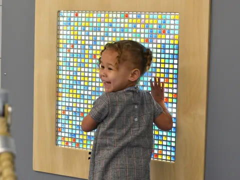 a boy holding a picture frame