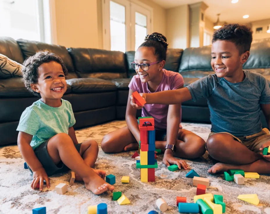 a group of people playing with toys