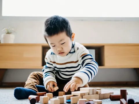 a child playing with blocks