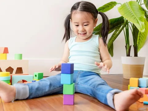 a girl sitting on the floor