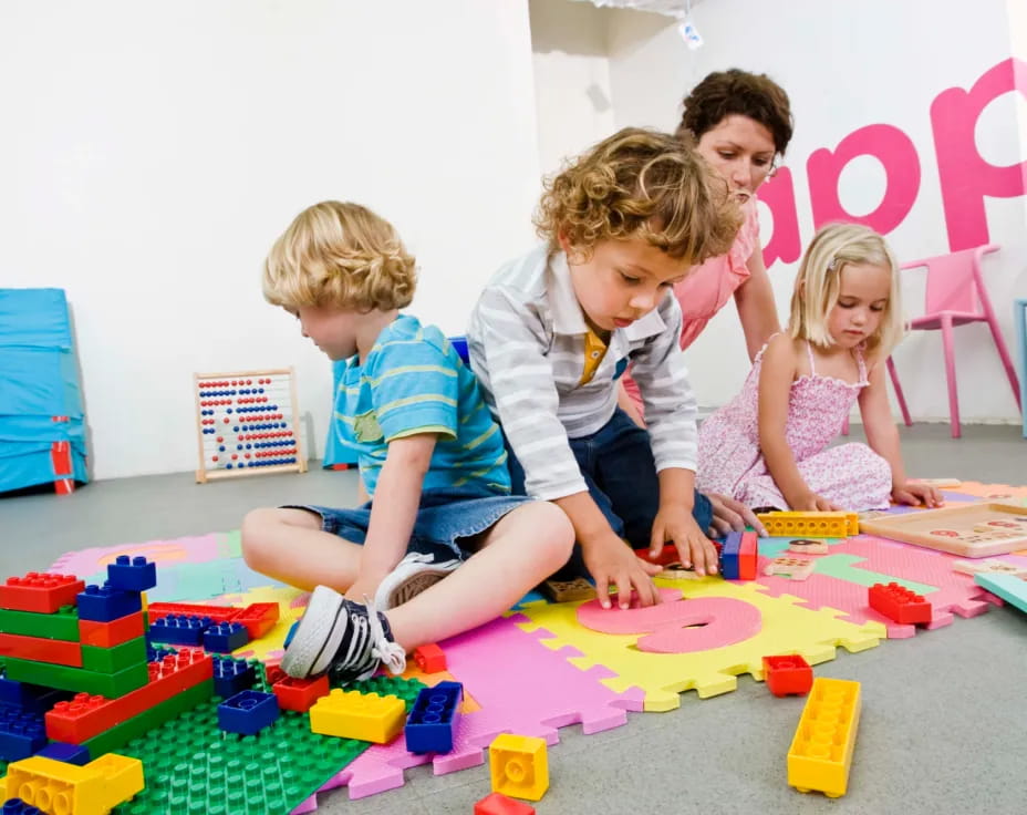 a group of children playing with toys