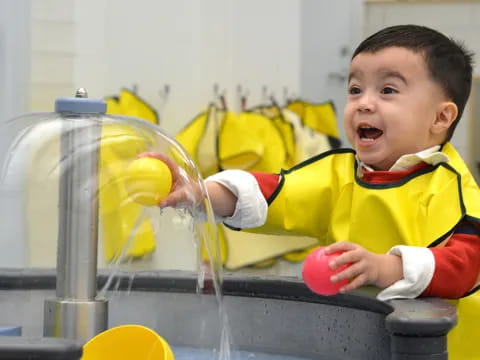 a baby playing with a toy