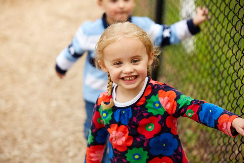a girl in a colorful dress