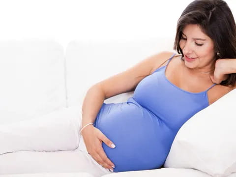 a woman lying on a bed