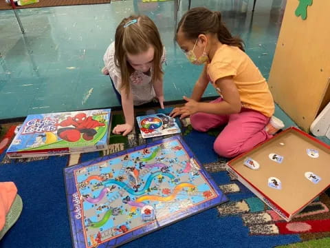 a couple of girls playing with toys