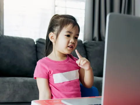 a girl sitting at a desk