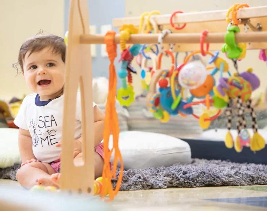 a baby playing with toys