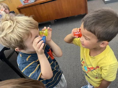 a couple of kids playing with toys
