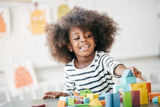 a child playing with blocks