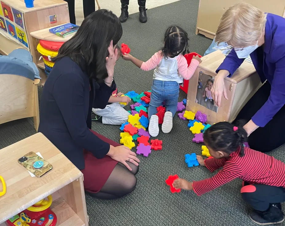 a person and a group of children