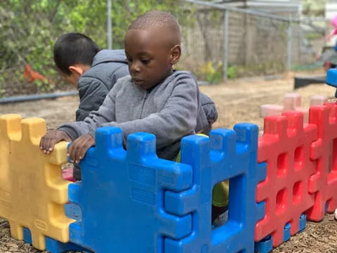 a couple of boys playing with toys