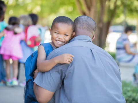 a person carrying a child