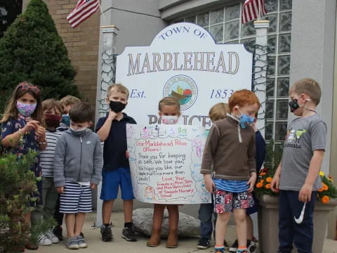 a group of people holding a sign