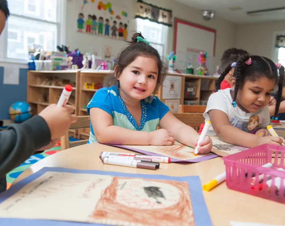 a group of children painting