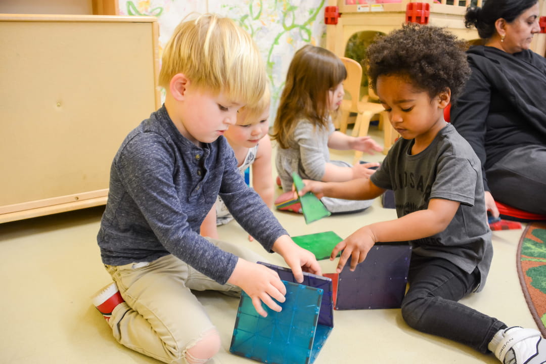 a group of children playing with a toy