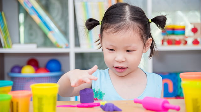 a baby girl with her finger up