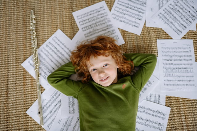 a child lying on a bed