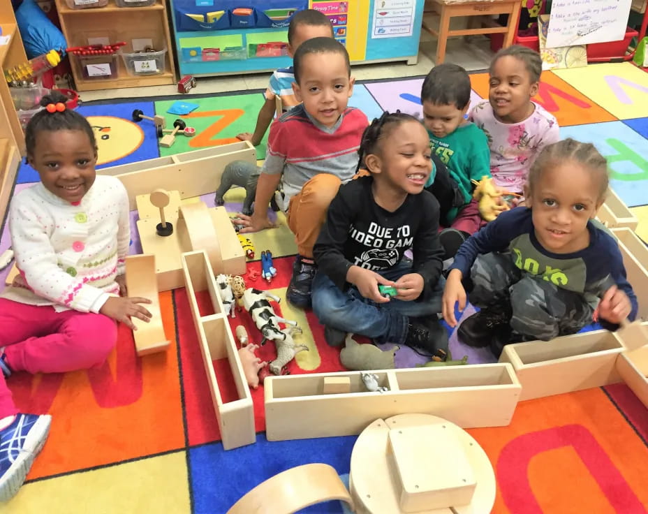 a group of children playing with toys