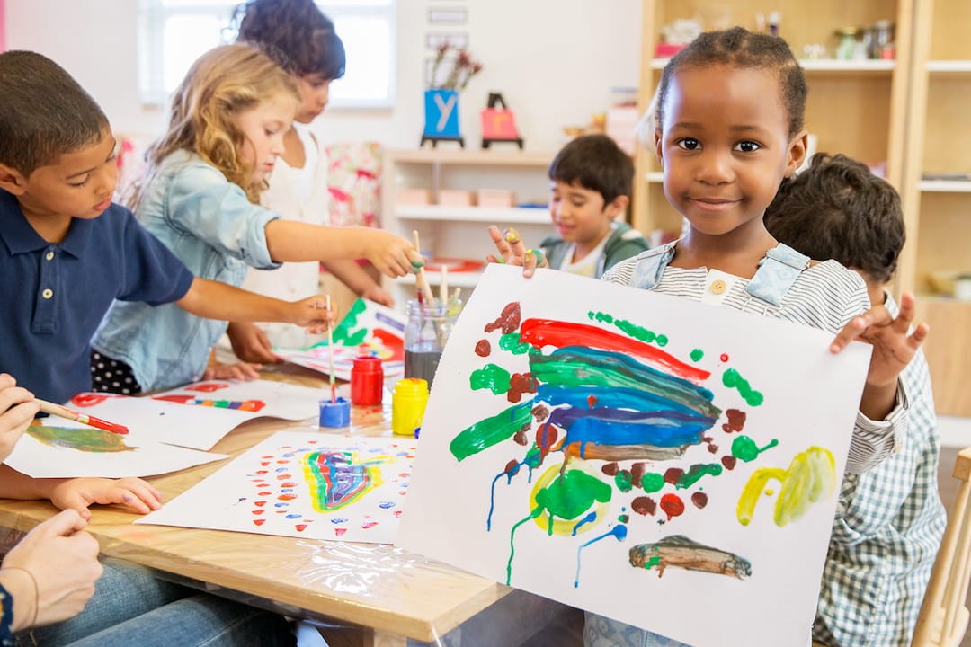 a group of children painting