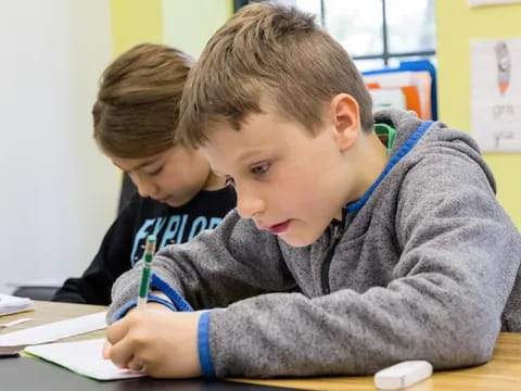a few young boys studying